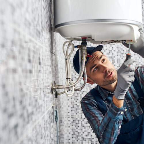 plumber installing a water heater