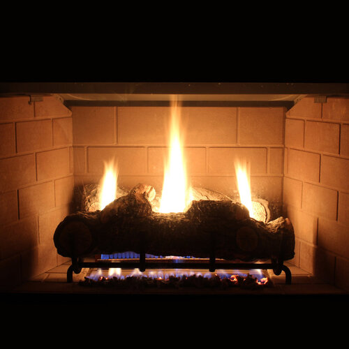 close-up of gas logs in a modern gas burning fireplace
