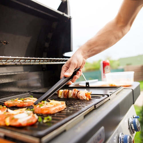 close-up of meat cooking on a gas grill