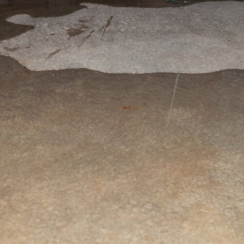 concrete flooring covered in water