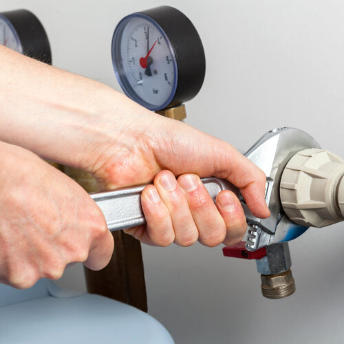 close-up of a plumber providing repairs