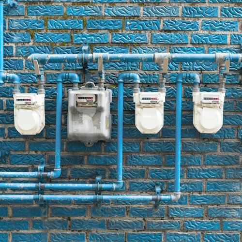 gas meters located on a blue wall
