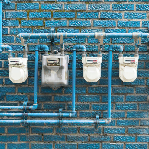 gas meters located on a blue wall